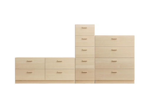 One low, one tall and one wide Relief drawer with plinth Ash